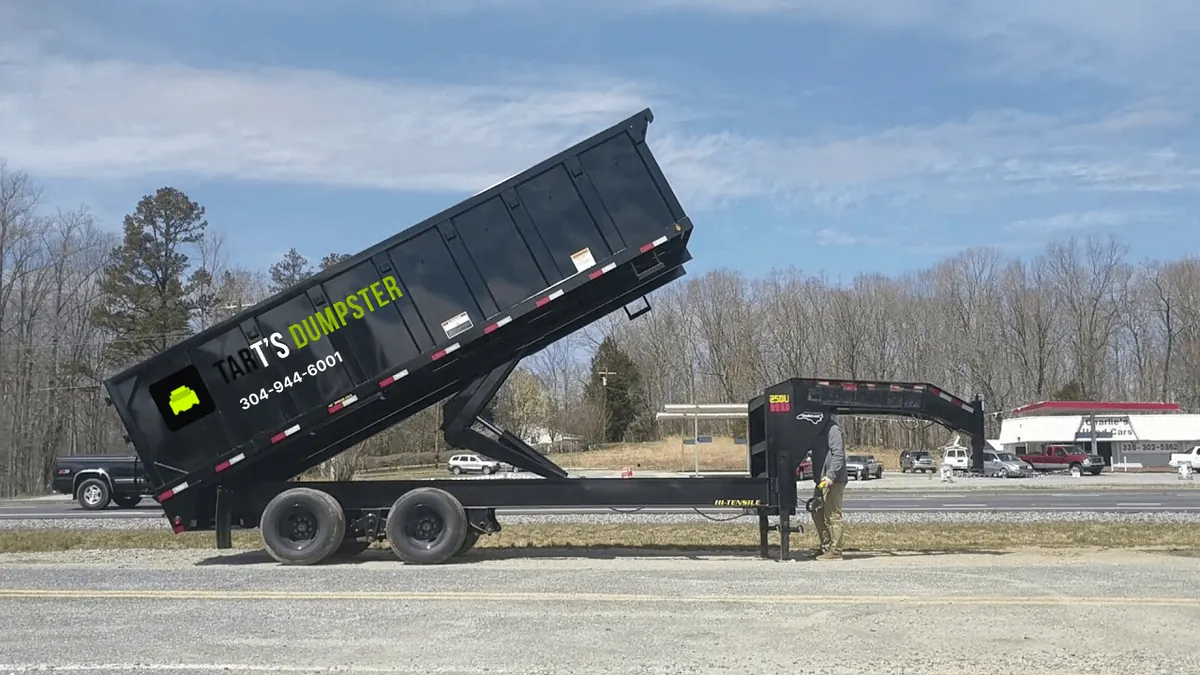 A Tart’s dump trailer offloading debris