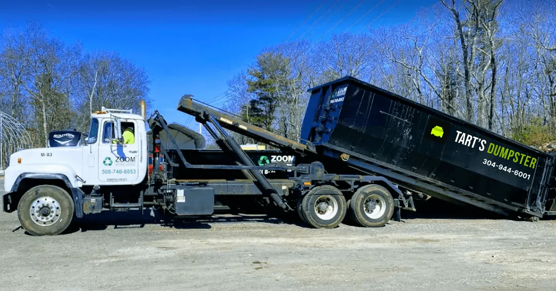 Tart’s roll-off truck delivering a dumpster