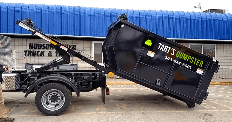 Tart’s roll-off truck loading a container